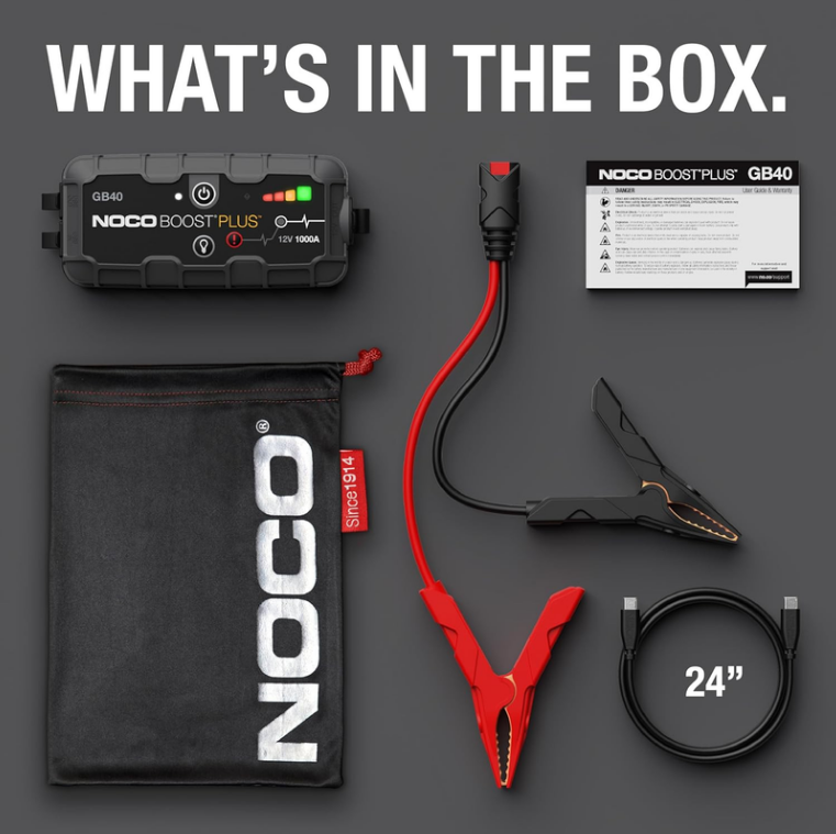 NOCO Boost GB40 1000A jump starter box contents with battery clamps, charging cables, storage bag and user guide